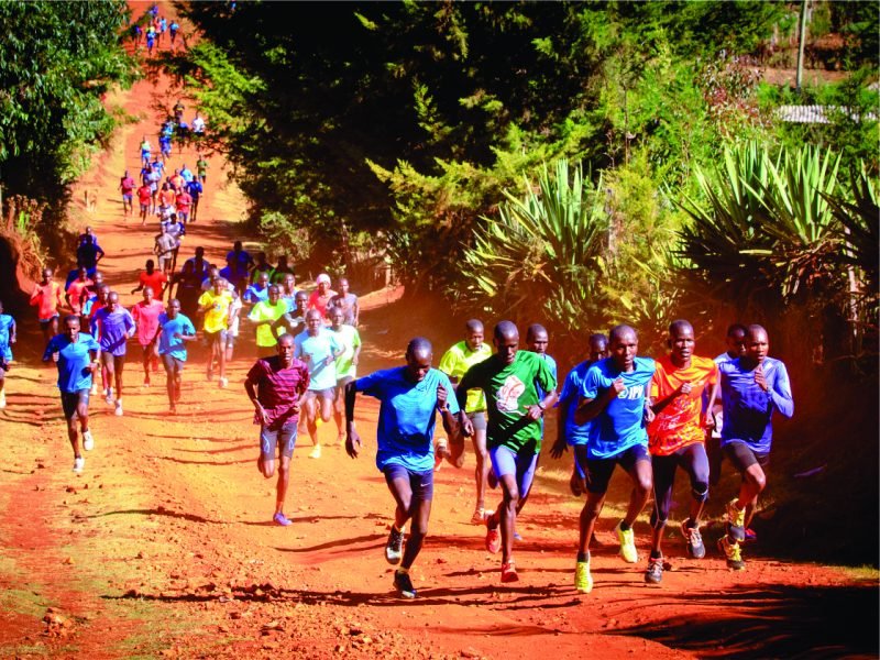 A large group of runners on the murram roads around Iten